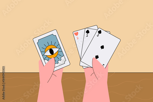 A pair of hands holding playing cards, including a tarot-style card and standard poker cards, symbolizing games and fortune.