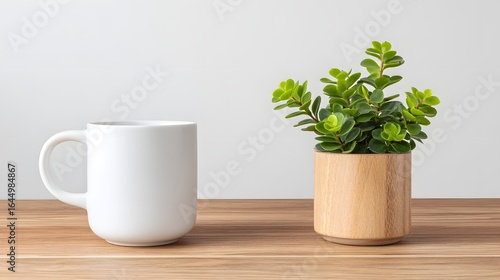 Wallpaper Mural Blank white mug and potted plant on a wooden table. Torontodigital.ca