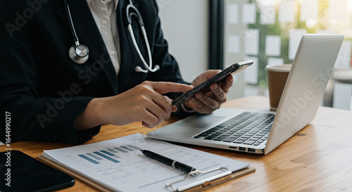 man working on laptop and mobile 