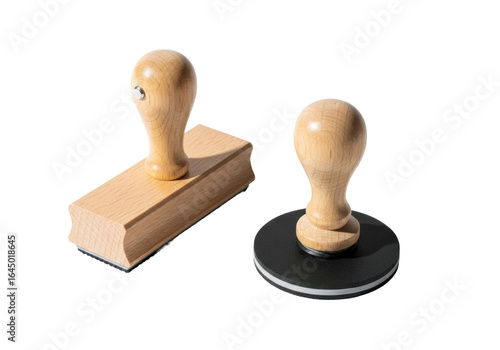 Two traditional wooden rubber stamps, one rectangular, one round, with light natural wood handles and matte black rubber pads, on a transparent background with strong shadows, high-angle