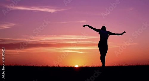 Wallpaper Mural Silhouette of woman dancing with arms outstretched at sunset   Torontodigital.ca