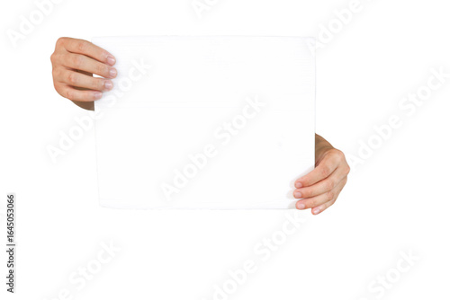 Two hands holding a blank white paper, isolated on a black background. Ideal for social media, advertising, promotion, or to add interesting text.