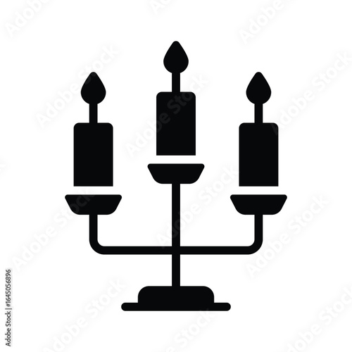 A solid icon showing elegant candle stand decor