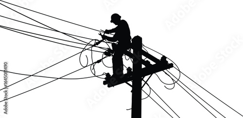 Silhouette of an electrician working a power line, highlighting importance of skilled workers in maintaining our electricity infrastructure