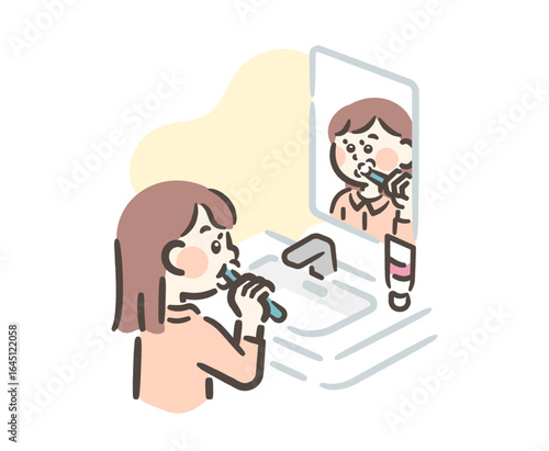 A girl brushing her teeth in the bathroom before going to bed