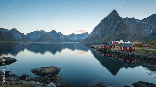 Serene Lofoten Islands: Red Cabins Reflecting on Calm Waters
