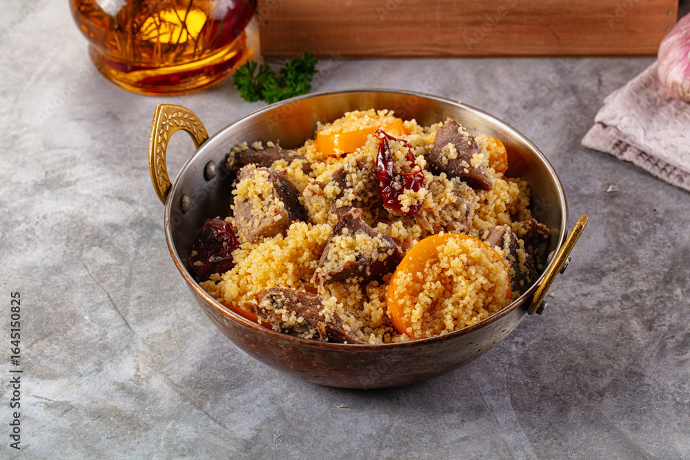 Fototapeta premium Traditional couscous with lamb and vegetables