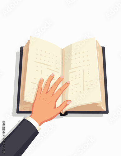 Hand reading Braille page in open book