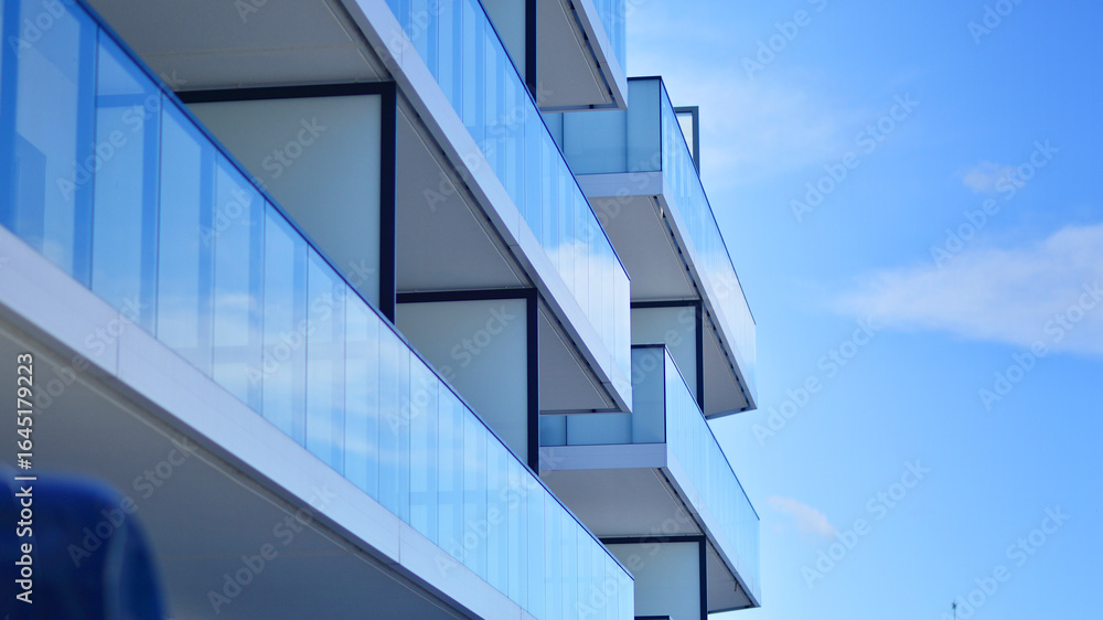 Obraz premium Modern architecture of urban residential apartment building. Apartment building exterior, residential house facade.