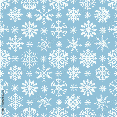 A repeating pattern of white snowflakes against a light blue background, creating a wintery texture.