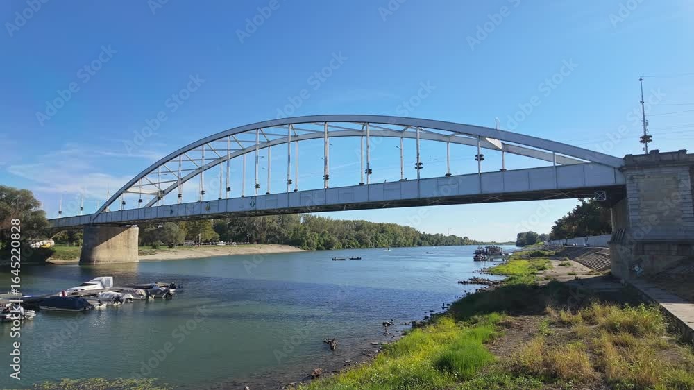 Downtown bridge, the first bridge in Szeged, connecting the city center with the park over the Tisza River in Hungary. Downtown bridge, the first bridge in Szeged, connecting the city center with the park over the Tisza River in Hungary.