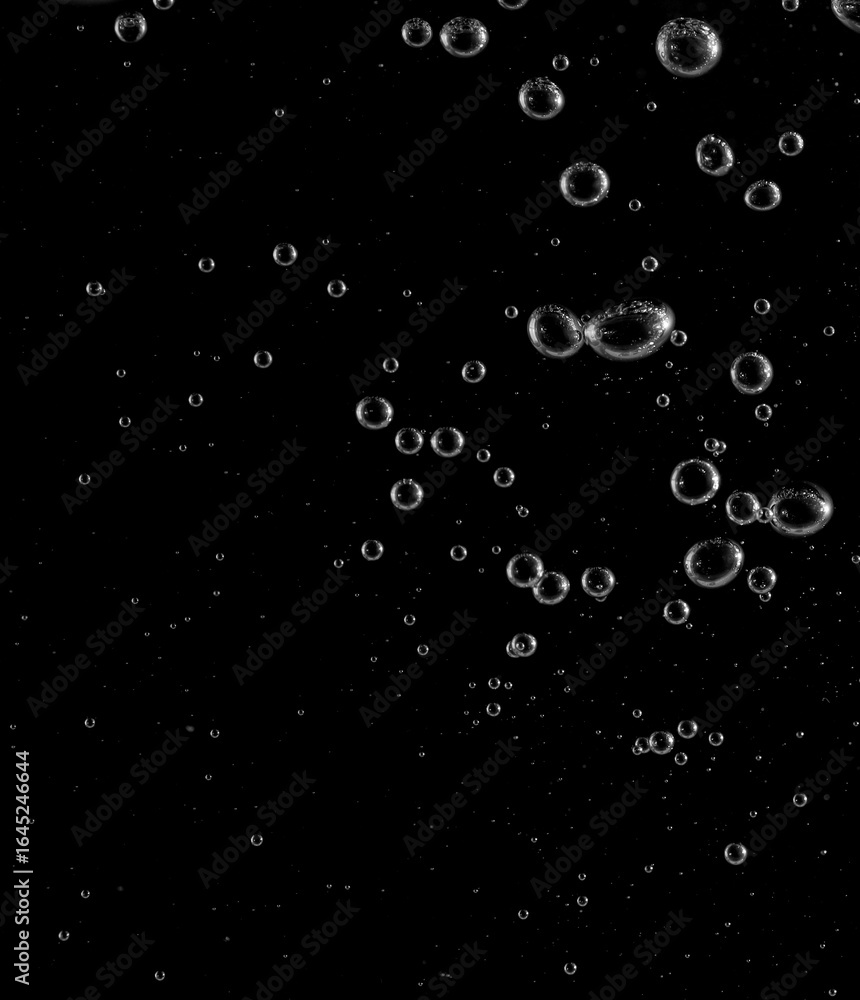 Underwater bubbles, Underwater oxygen design concept, Small water drops underwater, On black background, Close-up photography. Underwater bubbles, Underwater oxygen design concept, Small water drops underwater, On black background, Close-up photography.