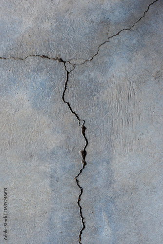 Close-up of cracked and rough concrete for overlay background.