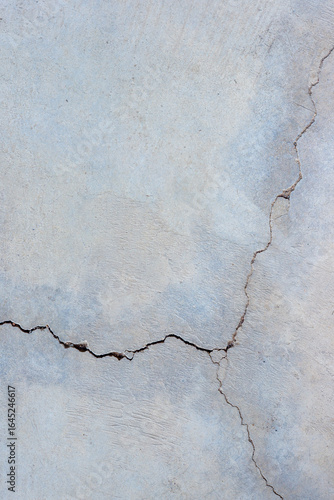 Close-up of cracked and rough concrete for overlay background.