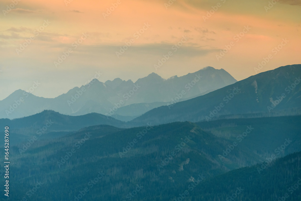 The Tatra Mountains at sunset, mountains arranged like layers. The Tatra Mountains at sunset, mountains arranged like layers.