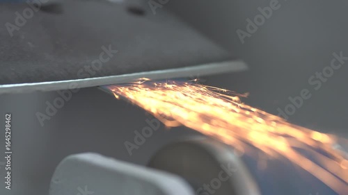 Detail of a master sharpening a steel knife