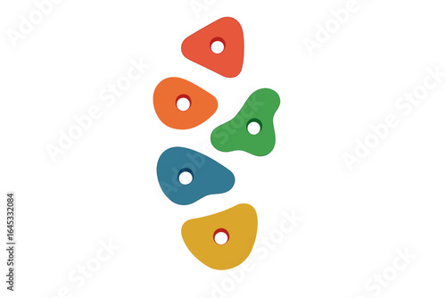 Colorful climbing holds arranged in a vertical line against a plain background for indoor wall climbing setup