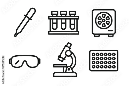 Laboratory equipment arranged on a flat surface showcasing various tools used in scientific research and experimentation