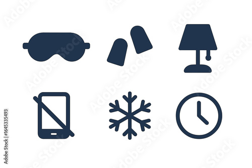 Items for creating a restful sleep environment including eye mask, earplugs, lamp, and clock