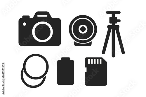 Essential camera equipment collection with tripod, lens, battery, and memory card in monochrome design