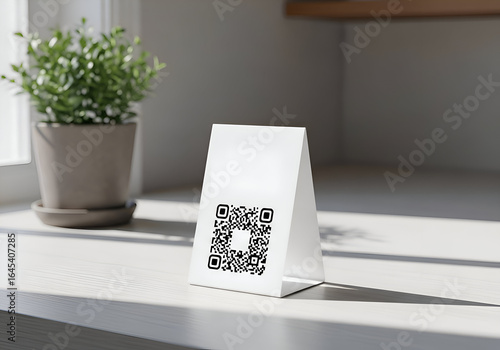 QR Code Sign on Countertop with Plant