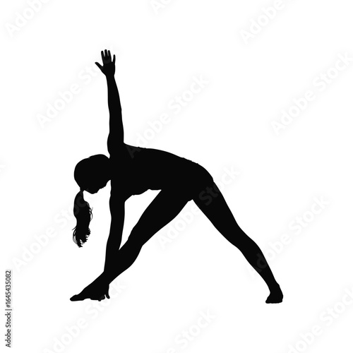 Silhouette of a woman performing a triangle yoga pose