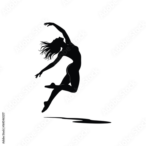 Silhouette of a graceful female dancer leaping with arms outstretched