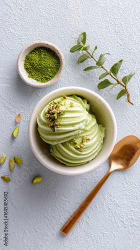 Wallpaper Mural Creamy green pistachio gelato in a bowl garnished with crushed pistachios, served with a golden spoon and matcha powder on the side Torontodigital.ca