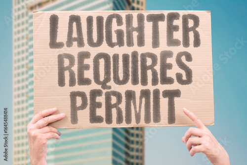 Obraz na płótnie "Laughter requires permit" — satirical statement on controlling happiness and restricting emotions