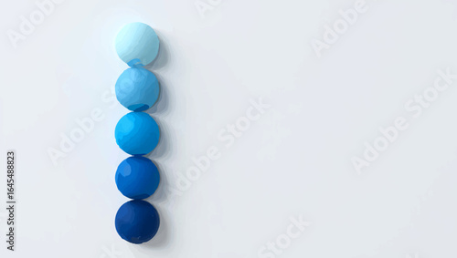 Gradient blue spheres lined up on white background

