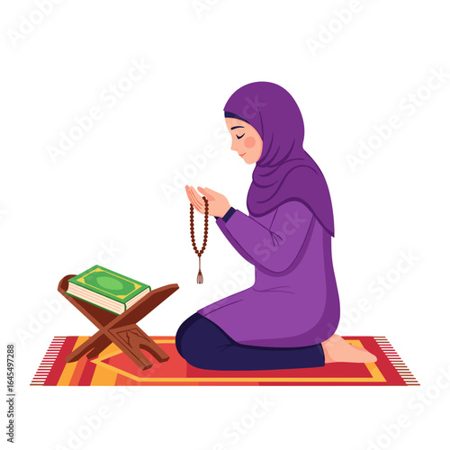 Young Muslim woman praying on prayer mat holding rosary
