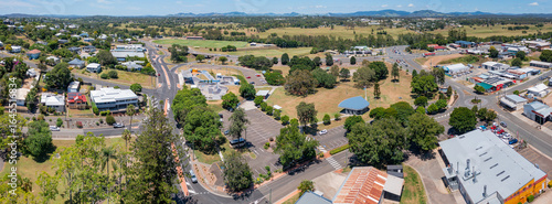 Aerial panorama of roads around housing and commercial outlets on the outskirts of a regional city