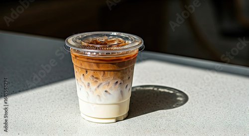 Iced Coffee Drink in Plastic Cup on Table