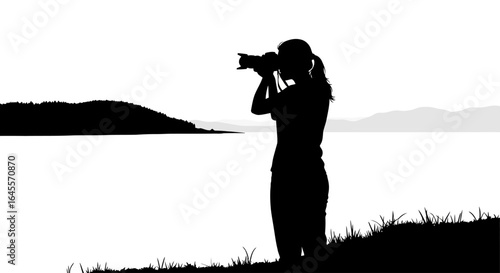 female photographer capturing serene lakeside landscape silhouette image for travel nature and photography websites