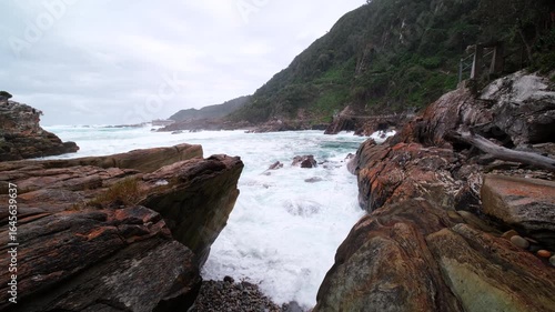 Ocean waves crashing into rocky coastline at Storms River mouth, Tsitsikamma