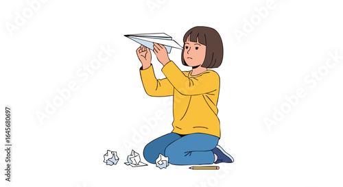 Creative young girl holding a freshly folded paper airplane.