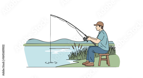 Man with a fishing rod sitting by the lakes edge.