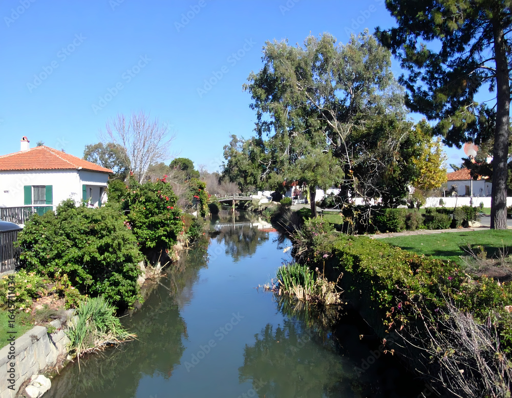Obraz premium Canal scene with residential properties