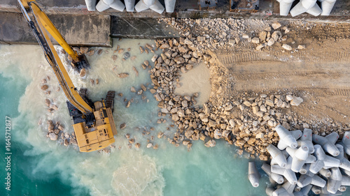 Photos Waterfront construction site with excavator
