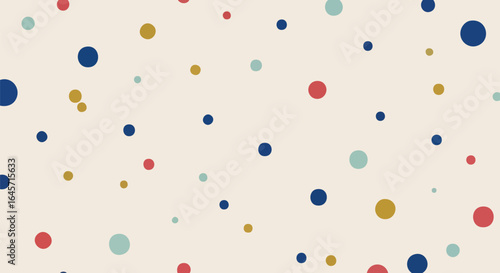 A playful abstract background with a multitude of colorful dots in varying sizes, randomly scattered across a light, neutral surface, ideal for modern graphics.