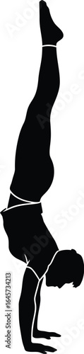 Silhouette of a man doing a handstand yoga pose, showcasing balance, strength, and fitness