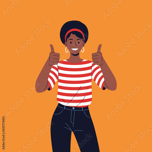 A black woman with short curly hair giving two thumbs up with a smile