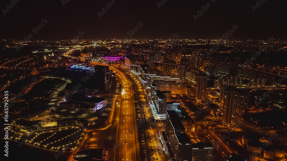 Fototapeta premium Aerial Nighttime View of Minsk with Illuminated Cityscape