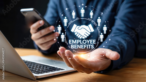 Modern businessman offering digital employee benefits solution from a laptop