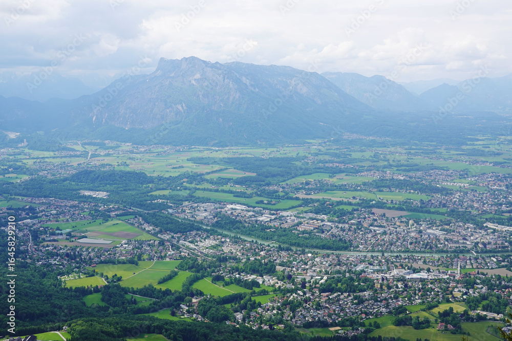 Fototapeta premium The panorama of Salzburg and the Untersberg mountain ridge from Gaisberg mountain, Austria