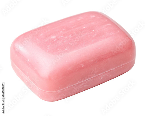 A soft pink bar of soap evokes gentle cleansing promising a spa like serenity isolated on dark