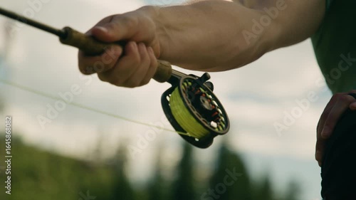 man casting a fly rod