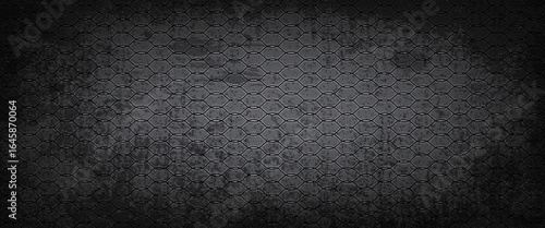 Dark hexagonal grid texture background with a metallic and grunge effect, perfect for technology, industrial, and futuristic design projects.