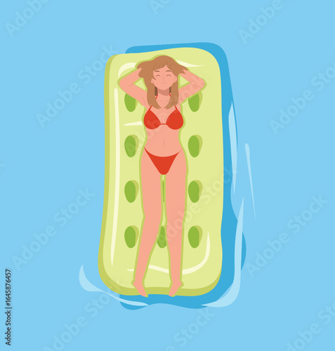 woman in red bikini lying on green inflatable mattress in blue pool water smiling and enjoying tropical summer holiday at resort