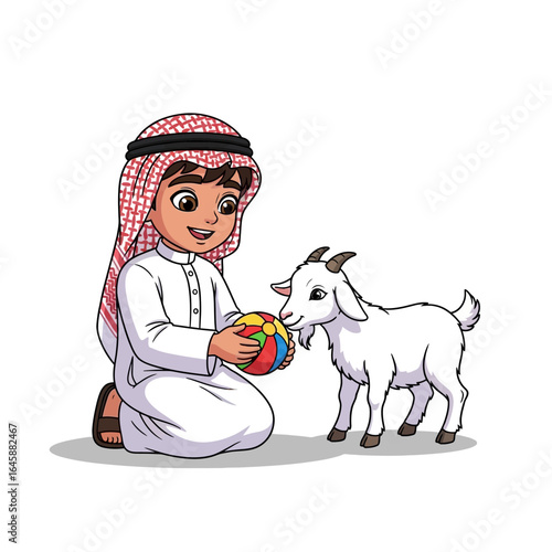 Smiling Arab boy in traditional thobe and ghutra kneeling while playing with a small white goat and a colorful ball.